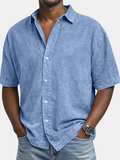 Casual woven button-front shirt with spread collar and short sleeves